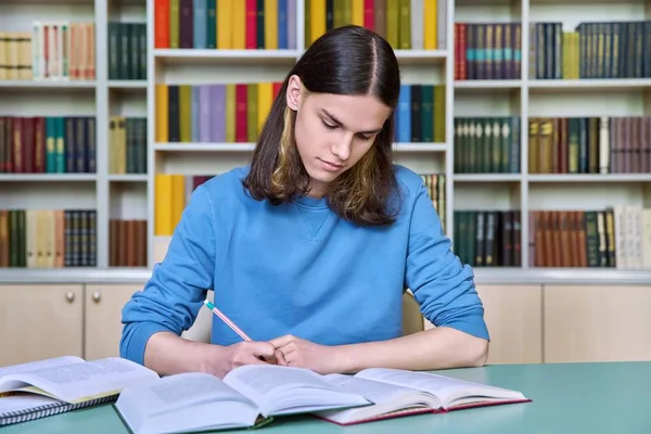 Teenage Guy Studying College Library Writing Notebook Reading Books Education Stock Image