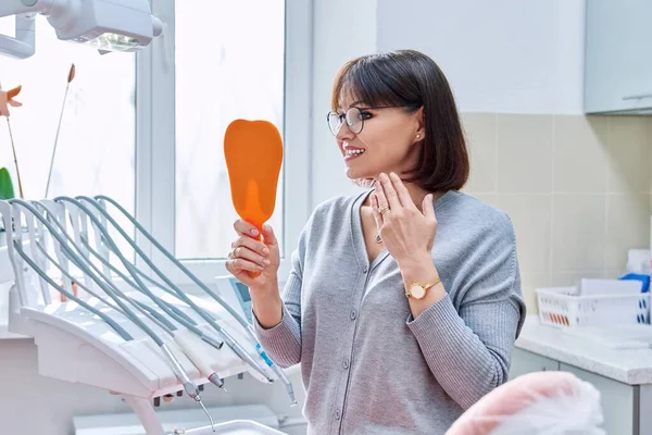 Happy Middle Aged Woman Dentist Patient Mirror Her Hands Looking — Stock Photo, Image