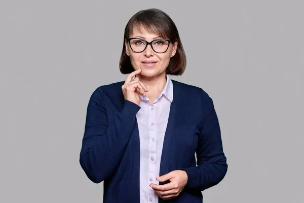 Portrait Mature Business Woman Glasses Looking Camera Gray Isolated Studio — Stockfoto