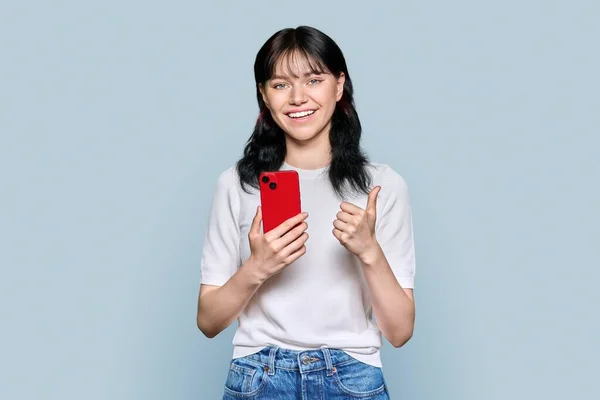 Portrait Young Happy Teenage Female Mobile Phone Smartphone Showing Gesture —  Fotos de Stock