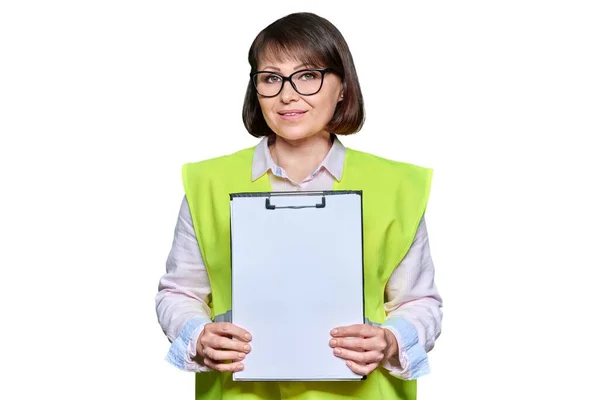 Mature Female Industrial Worker Protective Vest Showing Blank Sheet Copy — Stockfoto