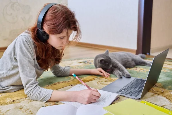 Preteen Girl Studying Headphones Laptop Lying Floor Cat Young Female — Foto Stock