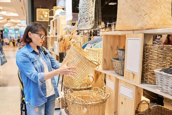 Mature Woman Shopper Choosing Interior Wicker Baskets Home Decor Store — Foto de Stock