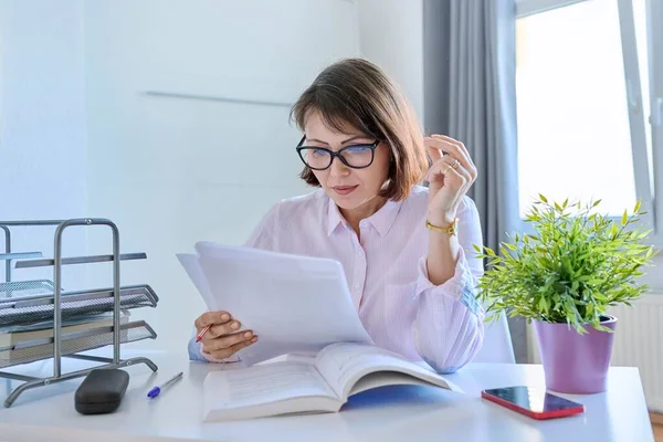 Middle Aged Female Working Home Table Papers Mature Woman Glasses — Zdjęcie stockowe