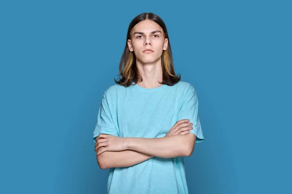 Portrait Confident Serious Teenage Guy Looking Camera Blue Color Background —  Fotos de Stock