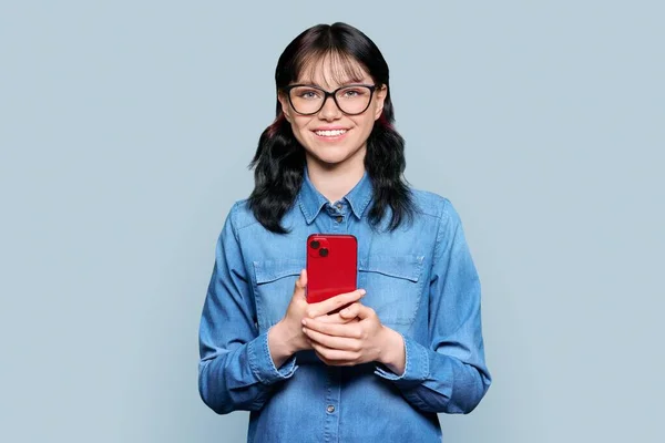 Happy Female Student Teenager Smartphone His Hands Gray Color Studio — 图库照片