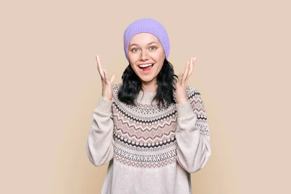 Happy Emotional Teenage Female Sweater Hat Light Brown Background Surprised — Foto Stock