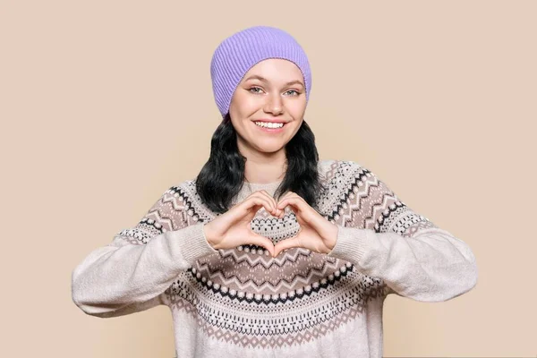 Young Beautiful Teenage Female Hat Sweater Showing Heart Gesture Hands — Foto Stock