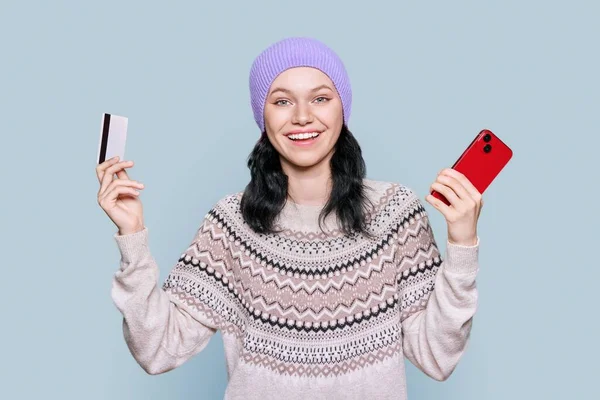 Beautiful Young Woman Sweater Hat Holding Credit Card Smartphone Looking — Stok Foto