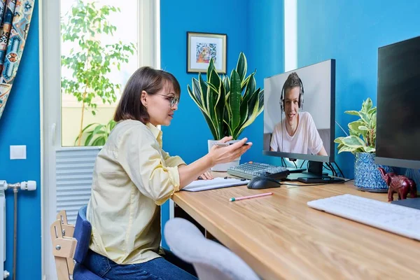 Mature Woman Talking Online Teenage Male Using Video Call Computer — Foto Stock