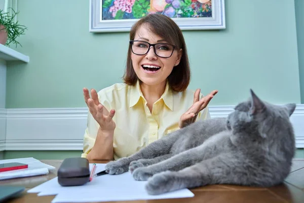 Positive Mature Woman Looking Webcam Home Workplace Pet Sleeping Cat — 图库照片