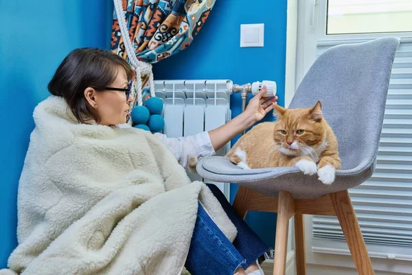 Woman Warm Blanket Cat Sitting Heating Radiator Adjusting Temperature Regulator — Stockfoto