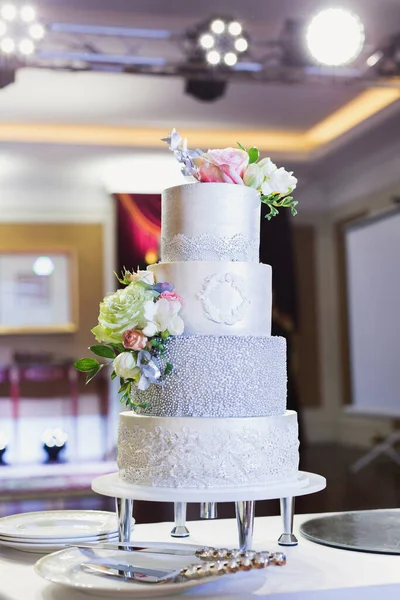 Beautiful wedding cake for the newlyweds at the wedding. A birthday cake at a banquet