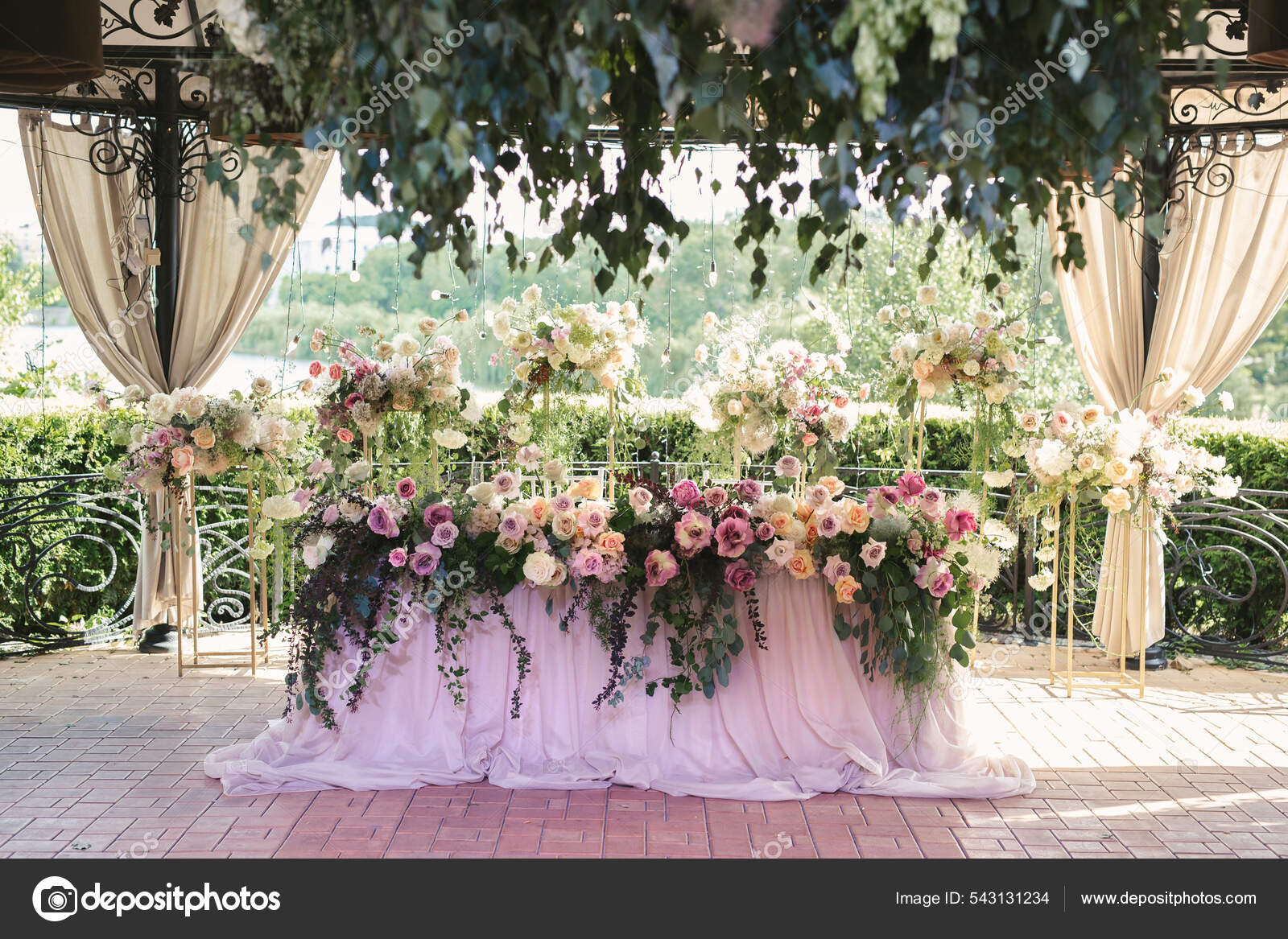 Bride and groom table setting and flower decoration. Presidium of