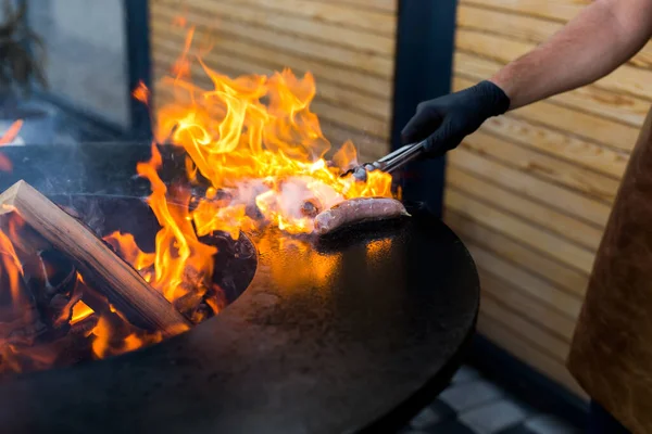 Sausage on Barbeque Smoker Grill. Hot and smoked sausage. Food Festival. — Stock Photo, Image