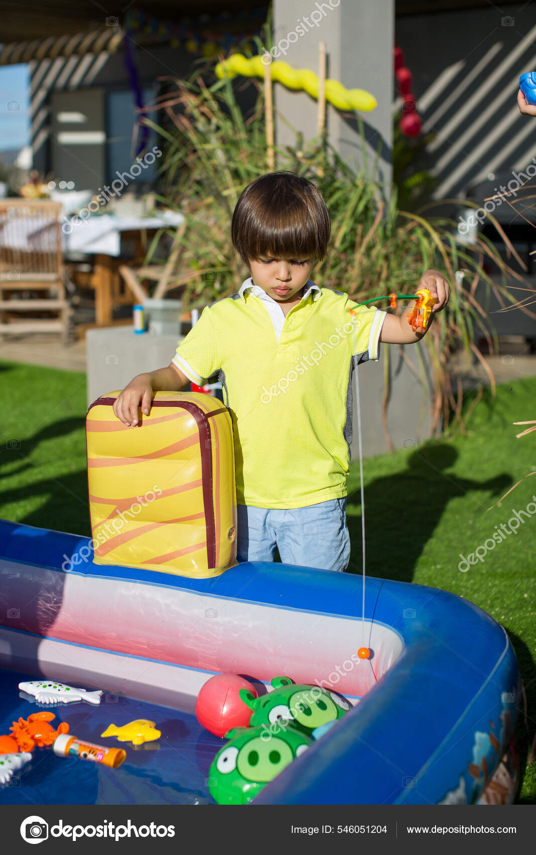 Fishing in the childrens pool. Little boys games Stock Photo by