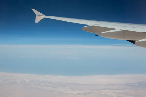 View from the window of the airplane window on the clouds — Stock Photo, Image