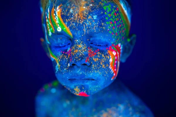 Portrait of a neon child boy posing in UV. — Stock Photo, Image