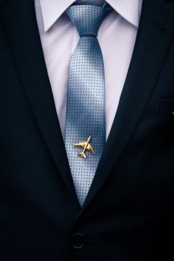 Man's jacket and tie with airplane tie-pin clipart