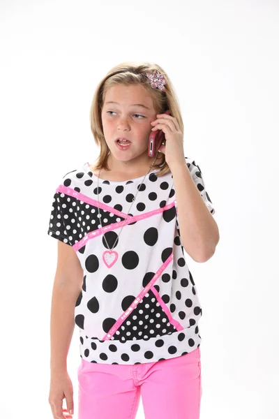 Tien-jarige meisje op de telefoon Stockfoto