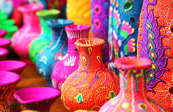 Colorful artistic pots or flower vases in vibrant colors