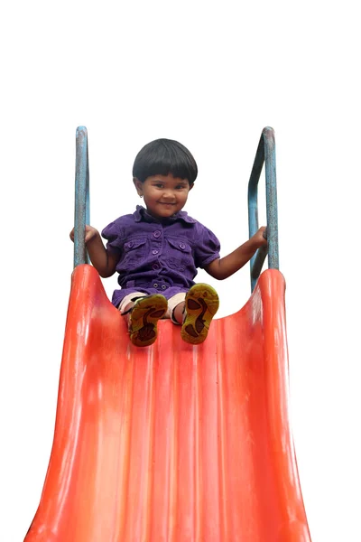 Beautiful cheerful(happy) indian girl(kid) on slider in a summer — Stock Photo, Image