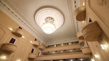 Vintage luster balconies and armchairs in auditorium