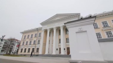 Palace of culture with columns at entrance on winter day