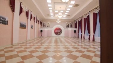Motion into assembly hall with festive decor at palace