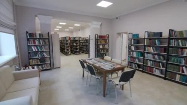 Table with newspapers and magazines in public library