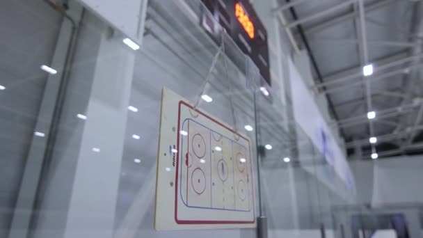 Ice arena plan on transparent shield at contemporary stadium — стоковое видео