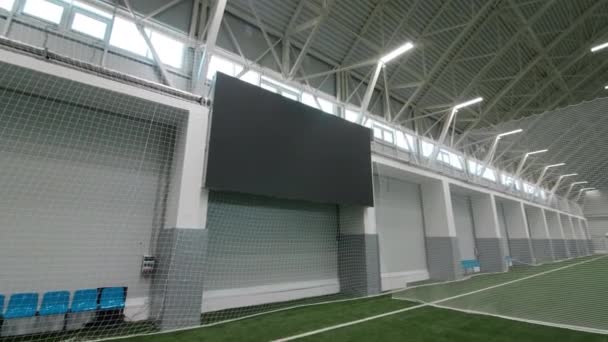 Large digital screen on wall by field for sportsmen training — Stok video