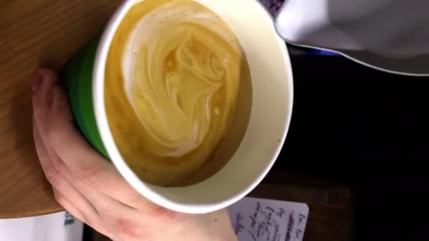 Barista adds milk cream and draws moon with heart in cup — Stock videók