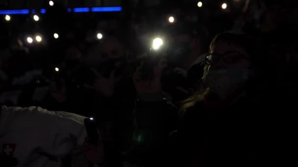 Crowd of sports fans holds mobile phones with flashlights — Stock Video