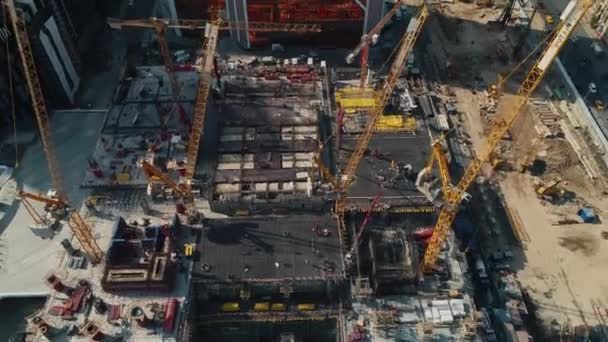 Cranes and equipment at office center construction site — Stock Video