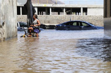 TENERIFE, SPAIN - AUGUST 29: Flooding due to high tide that floo clipart