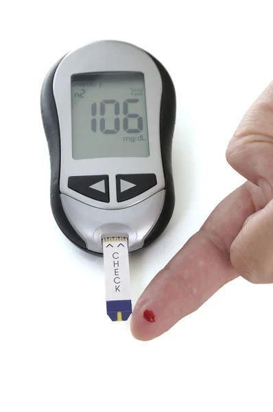 Glucometer, met een 106 lezen weergegeven. — Stockfoto