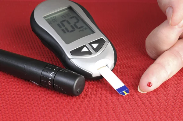 Glucometer, with a 102 reading displayed. — Stock Photo, Image