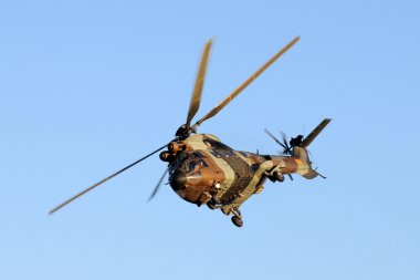 A antitank helicopter on sky clipart