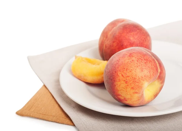 Peach on a white plate — Stock Photo, Image