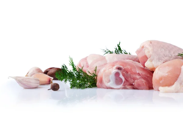 Raw chicken legs with garlic cloves — Stock Photo, Image