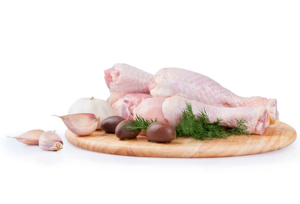 Raw chicken legs with olives — Stock Photo, Image