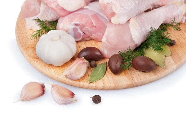 Raw chicken legs with olives and garlic — Stock Photo, Image