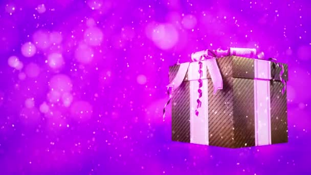 雪の降るピンク色のプレゼントボックスを — ストック動画