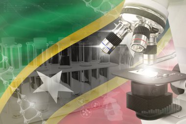 Saint Kitts ve Nevis bayrağı üzerine mikroskop. Bilimsel gelişim dijital arka planı. Biyoteknoloji tasarım konsepti araştırması, nesnenin 3 boyutlu illüstrasyonu
