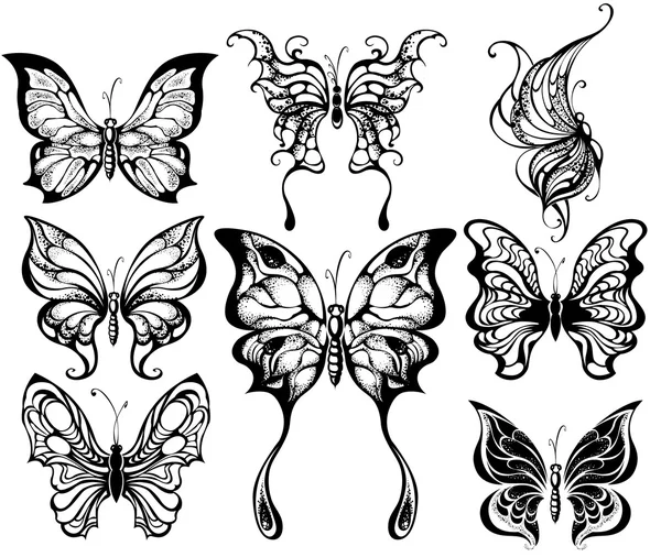 Silhouettes of exotic butterflies — Stock Vector