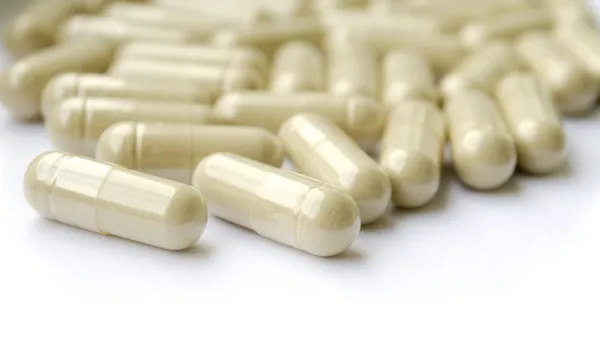 Pills of herb supplement — Stock Photo, Image