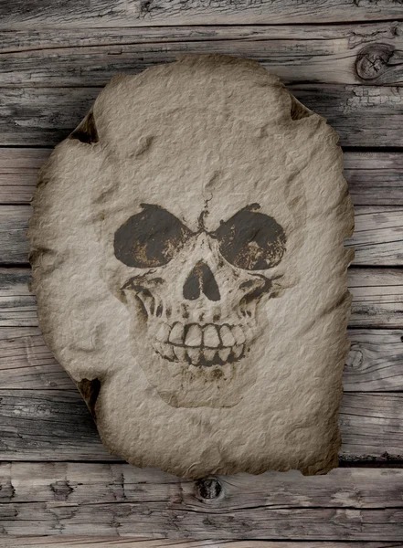 Un cráneo humano en un viejo papiro — Foto de Stock