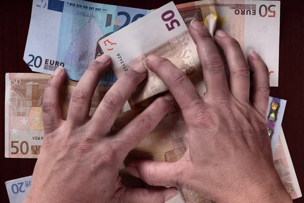 Dirty hands and money — Stock Photo, Image