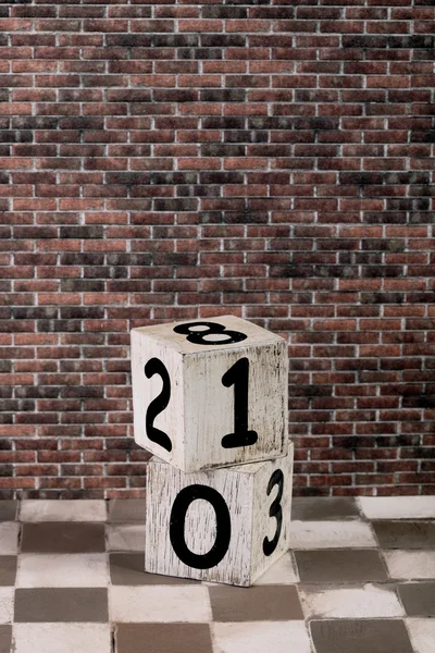 Dice and brick wall — Stock Photo, Image